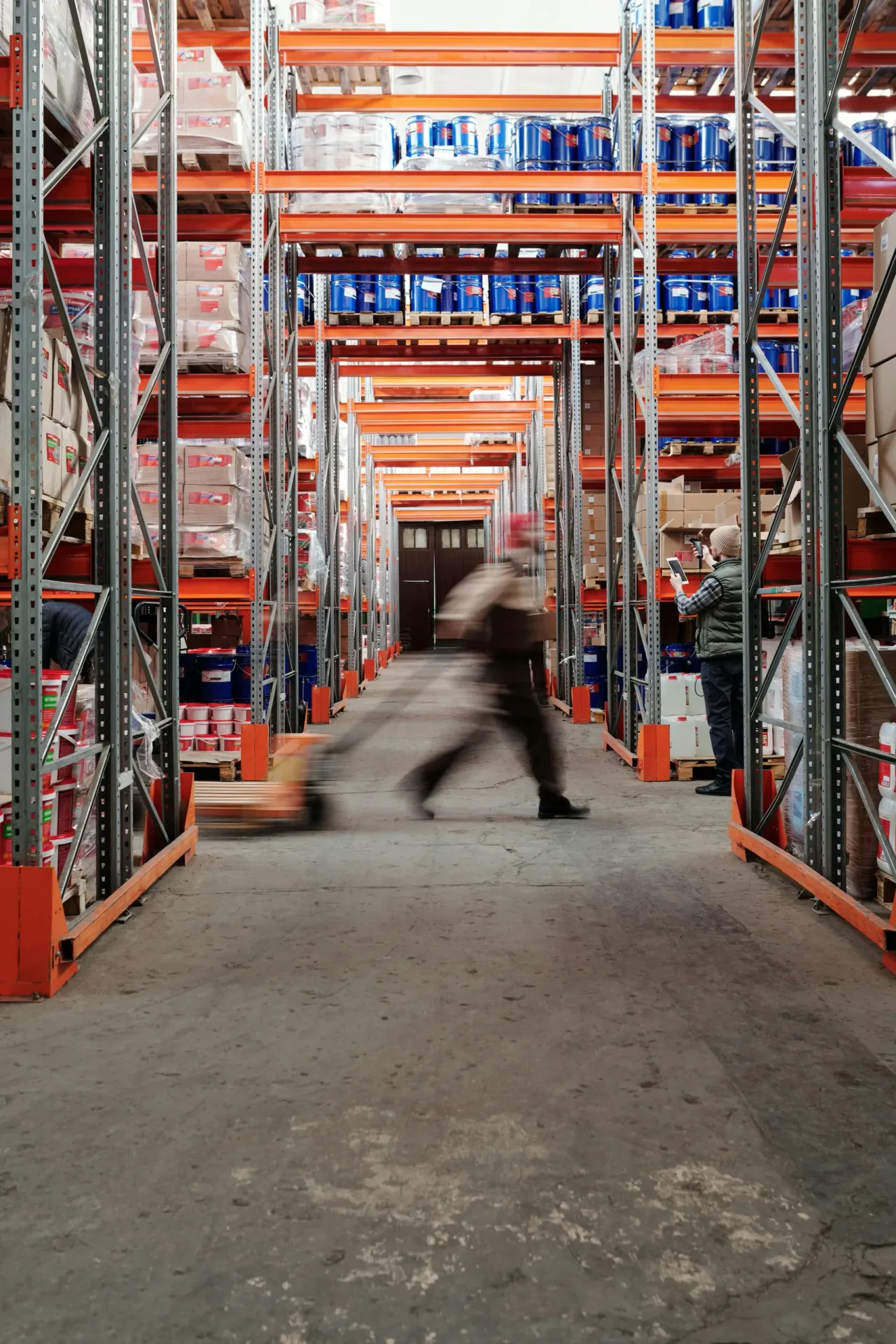 Worker moving freight inside a warehouse