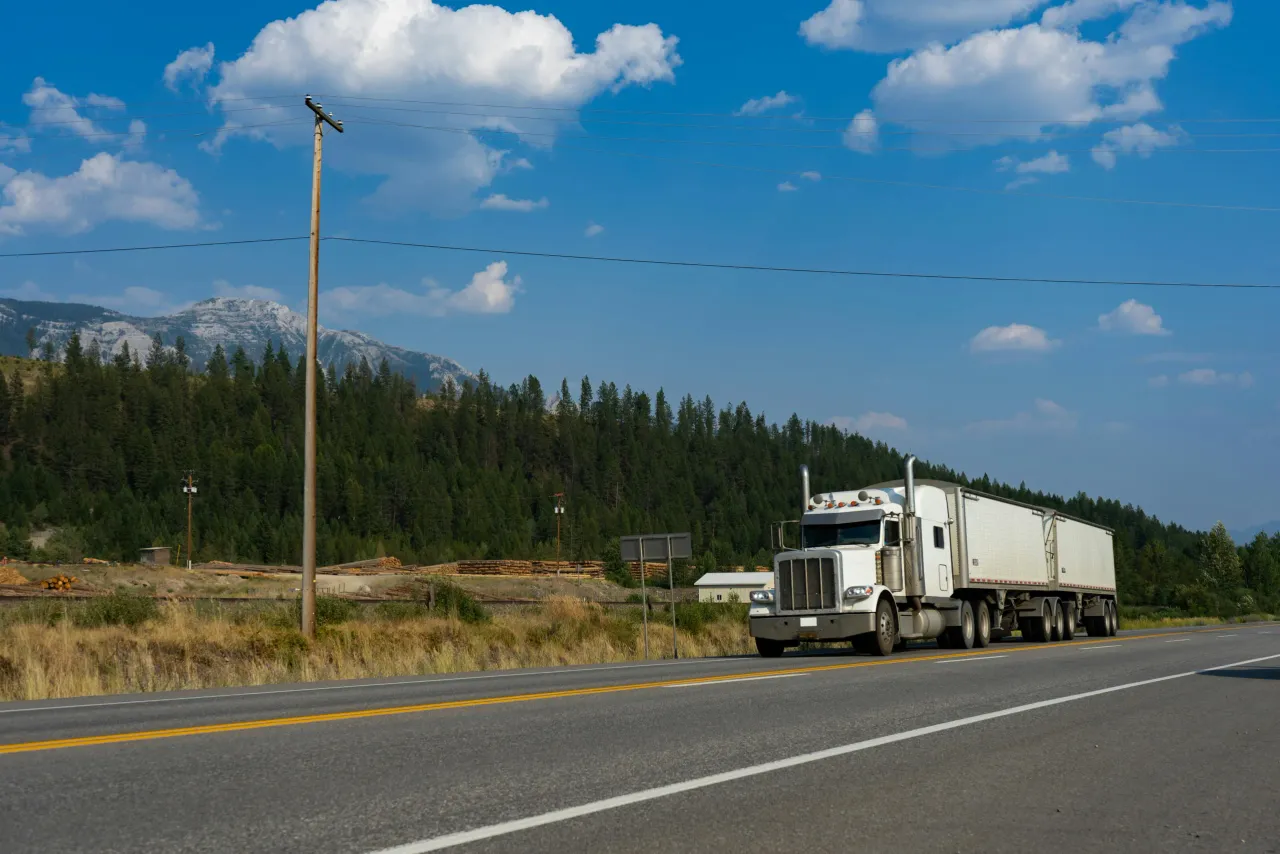 Semi truck rolling down an open highway
